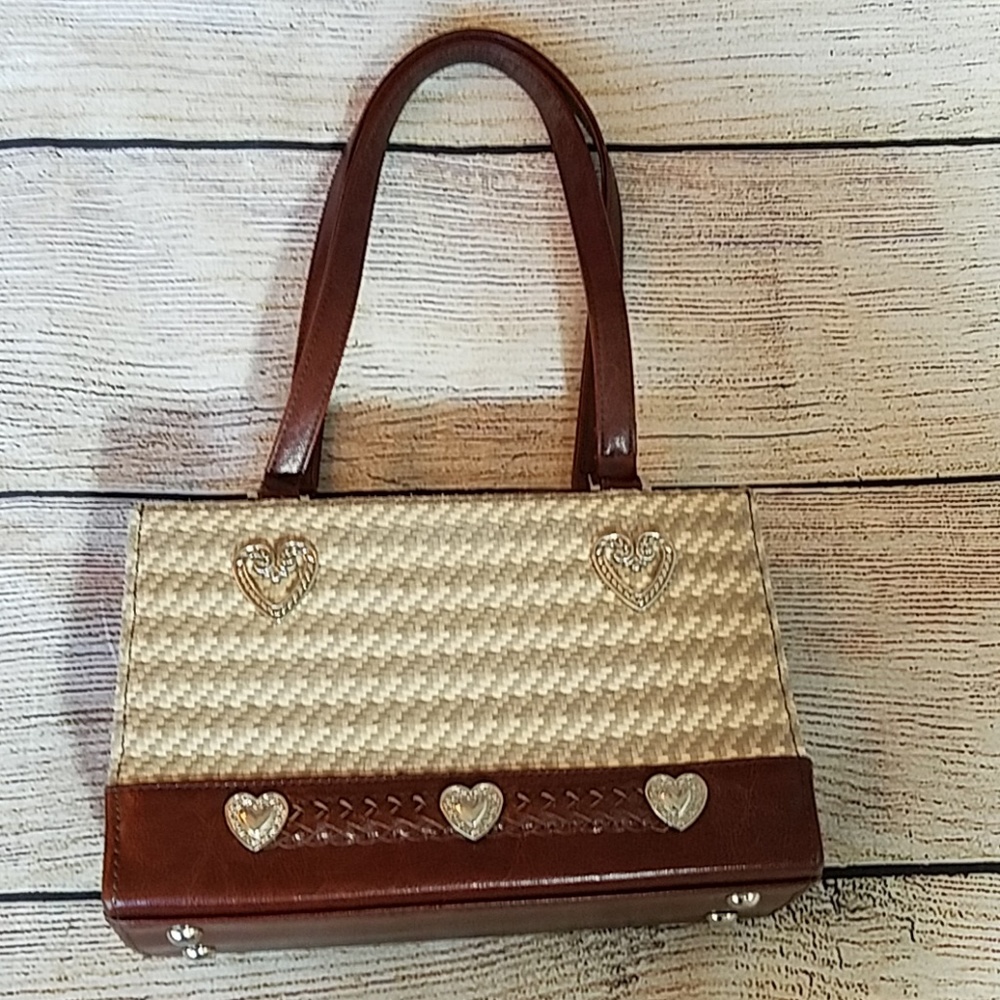 Straw and man made leather handbags